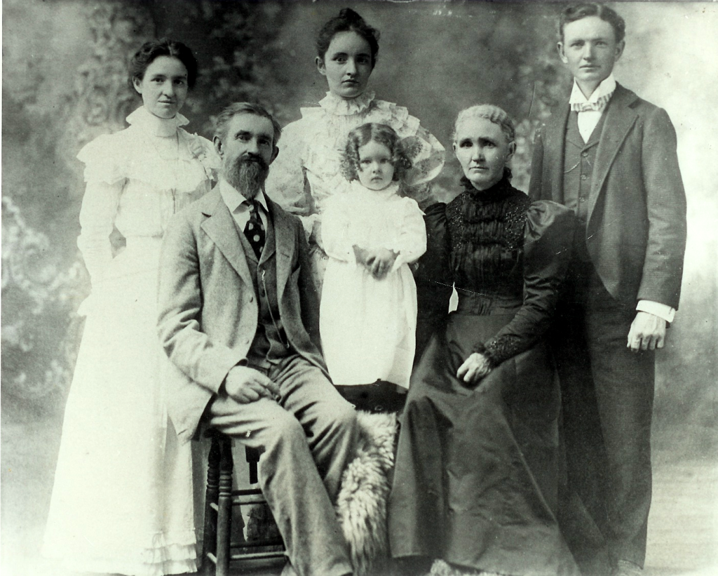 Front row: Alexander and Martha Bell with a grandchild; Back row, left to right: Bertha, her sister Eudora, and her brother Gordon. Springfield, Missouri, 1897