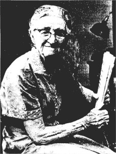 Bertha Bell Whitelaw, age 90, holding a newspaper for which she had recently written an article. (Goodell, 1962)