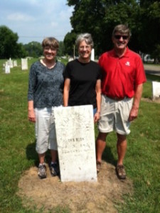 Susan, Nancy and John Whitelaw at the gravestone of Michael Duval, the father of Marcellisse Duval Goulet. St. Antoine Old Burying Ground, Monroe, MI. 2011.
