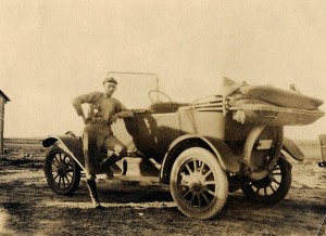 Olin Love and his car, about 1918.